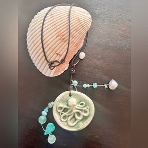 Handcrafted pottery with topaz gems, and other unique stones